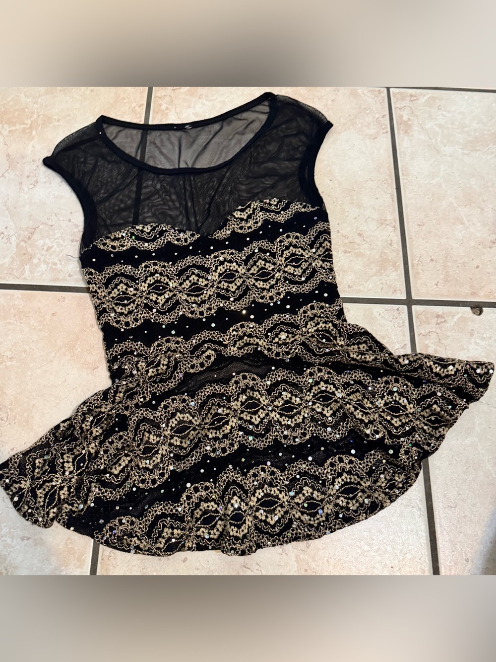 Black & gold lace peplum top with sequins and mesh details